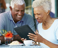 happy couple using ipad